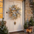 Gold and sage Christmas wreath on a white cottage front door