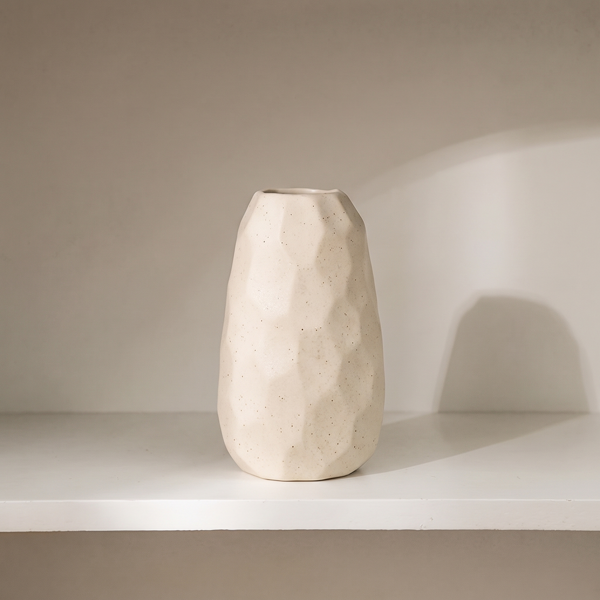 Matte white ceramic vase, faceted shape
