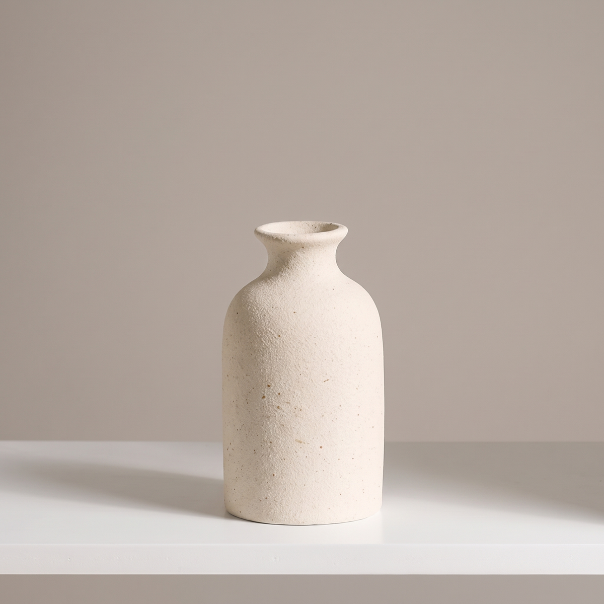 Matte white ceramic vase, short bottle shape