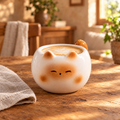 cute ceramic kitten coffee cup filled with a latte