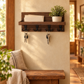 Rustic wooden key holder with mail shelf on an entryway wall