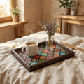 Bohemian mosaic wooden tray with coffee on a linen bed