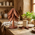 Wooden tree trivet set on a cozy kitchen counter with a mug